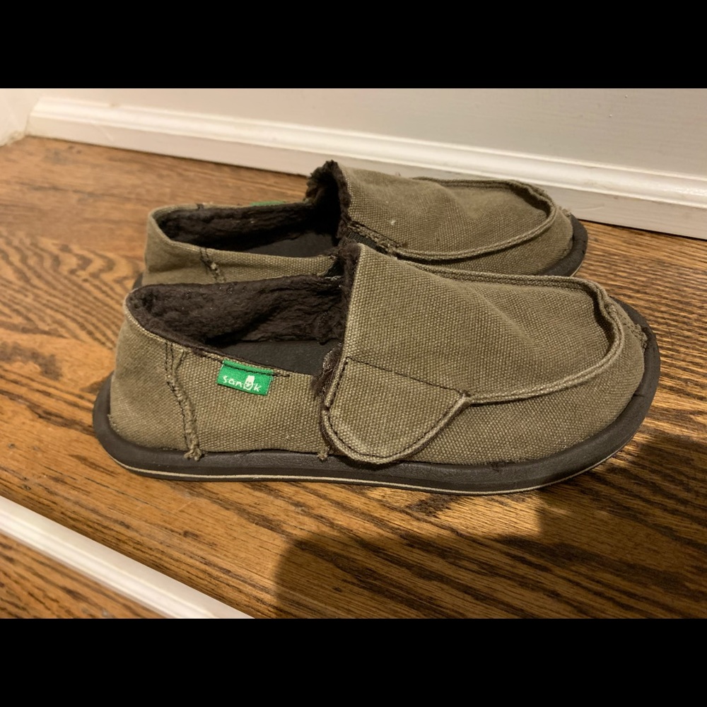 Sanuk slip on with velcro strap and fleece inside.  Brown size 13 boys/girls